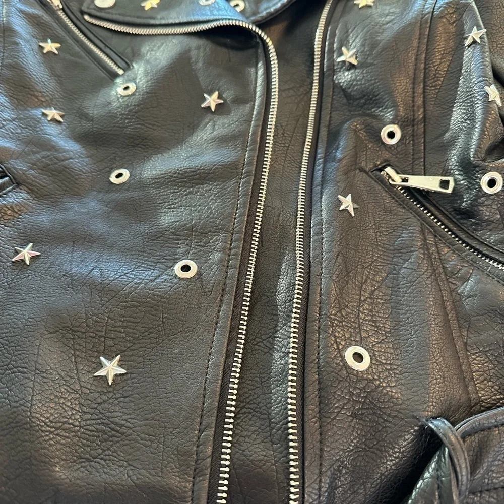 Edgy Moto jacket with studs, perfect layering over jeans or a skirt